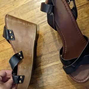 Black leather sandals, gold rivets, wood wedges